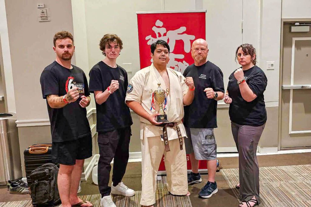 Daniel In with his 3rd-place trophy and members of McCreery Karate-Do at the 6th All-American Full-Contact Championships