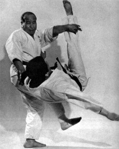 Mas Oyama demonstrating a throwing technique with a karate partner