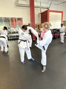Two Kyokushin karate practitioners spar during the Knockdown Fighting Seminar at Kaizen Kan Dojo in Tucson, Arizona.